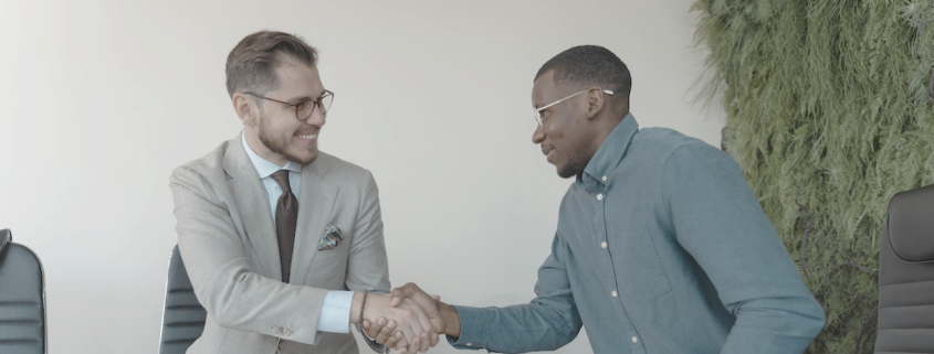 Two men shaking hands following a job interview.